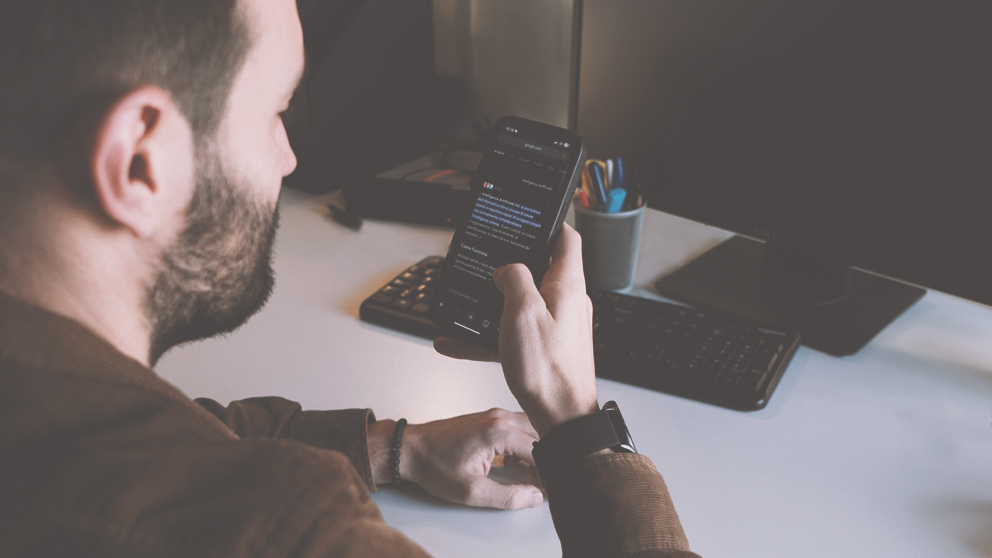 A man views Google's AI Mode on his smartphone